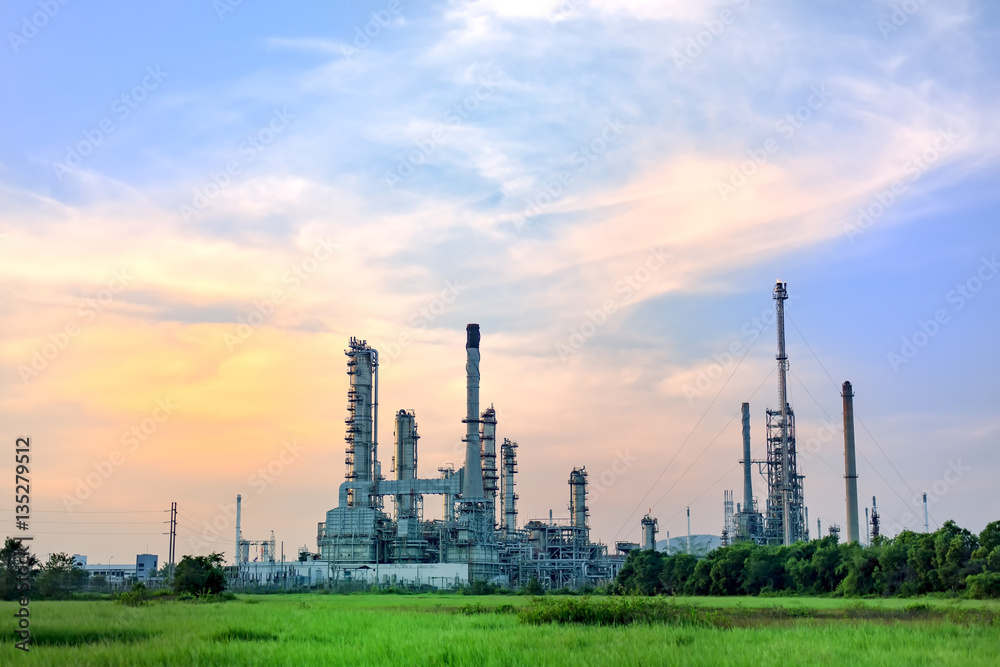 Big Industrial oil tanks in a refinery with treatment pond at industrial plants