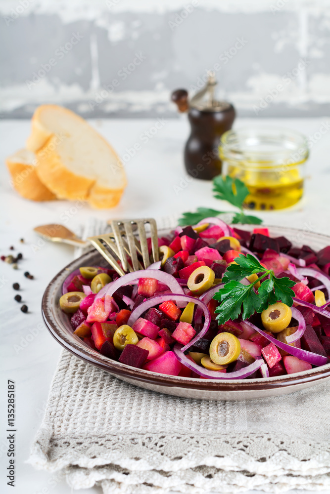 Vinegret.Traditsionny Russian and Ukrainian vegetable salad with beets, onions, potatoes, cucumbers and parsley. Selective focus. Vinegret.Traditsionny Russian and Ukrainian vegetable salad with beets, onions, potatoes, cucumbers and parsley. Selective focus.