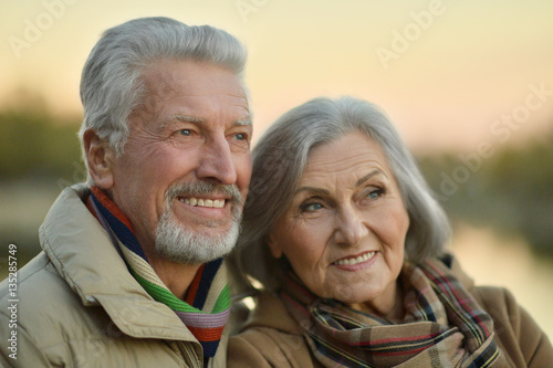 Happy senior couple near river