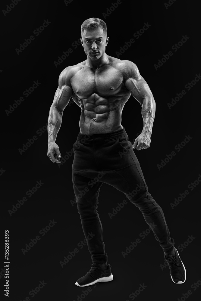 Naklejka premium Shirtless male model posing muscular core