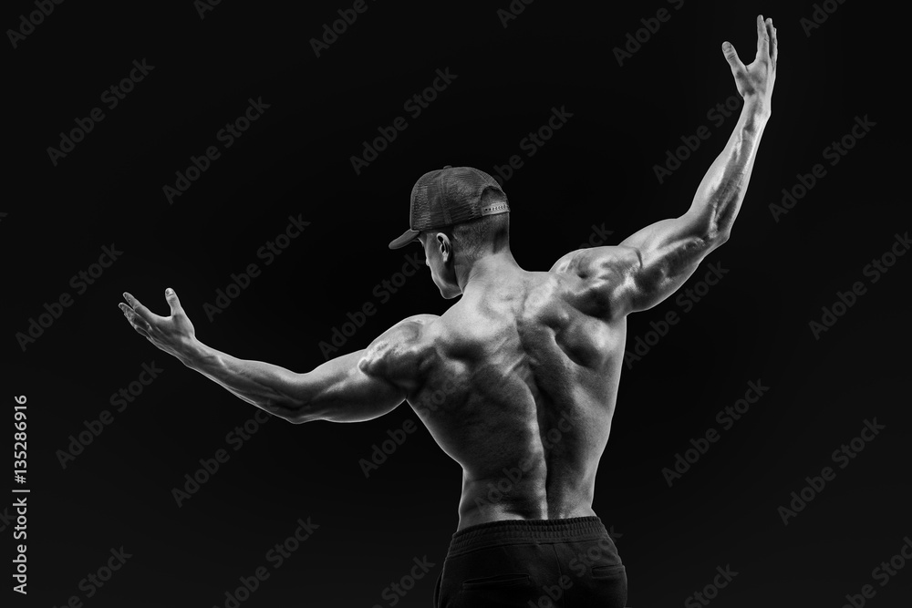 Obraz premium Athlete turning back and rise both hands