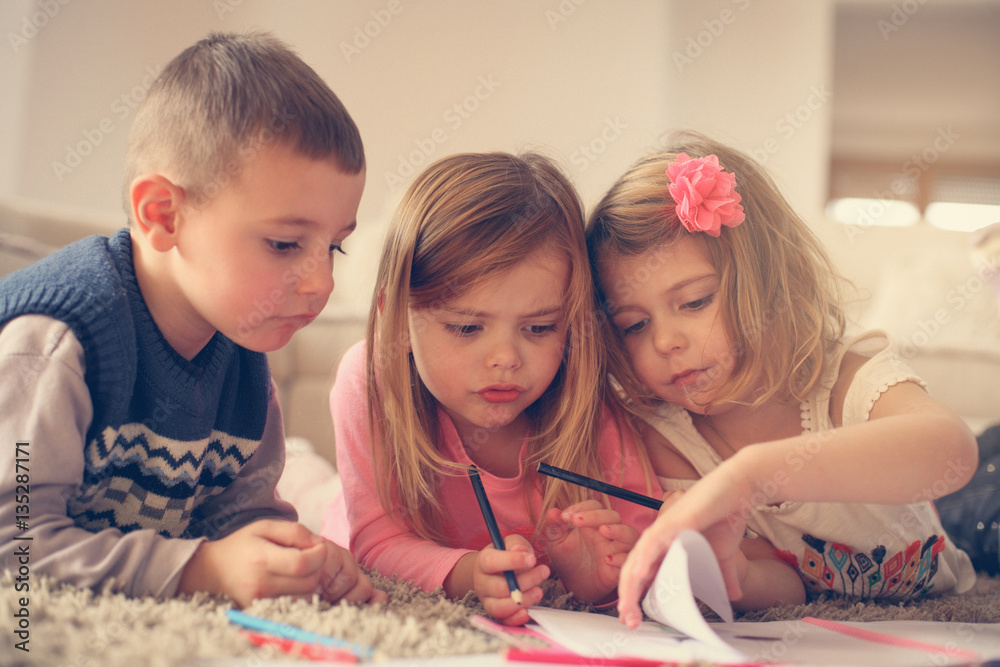 Fototapeta premium Children lying on the floor.
