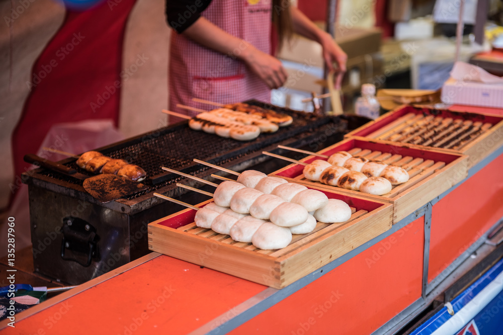 Street foods being prepared in the market. Japanese street foods are very delicious and comes in different flavors. They comprise mostly of seafoods.