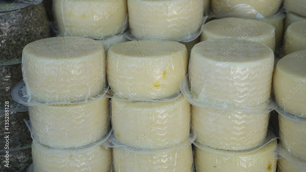 Batch of handmade cheeses, typical Spanish food, vinegar pickles Batch of handmade cheeses, typical Spanish food, vinegar pickles