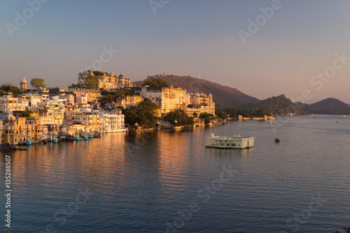 The famous city palace on Lake Pichola reflecting sunset light. Udaipur  travel destination and tourist attraction in Rajasthan  India