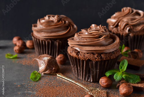 Chocolate cupcakes with peanut paste the old grunge background