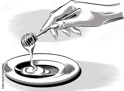 Female hand pouring honey into a saucer.