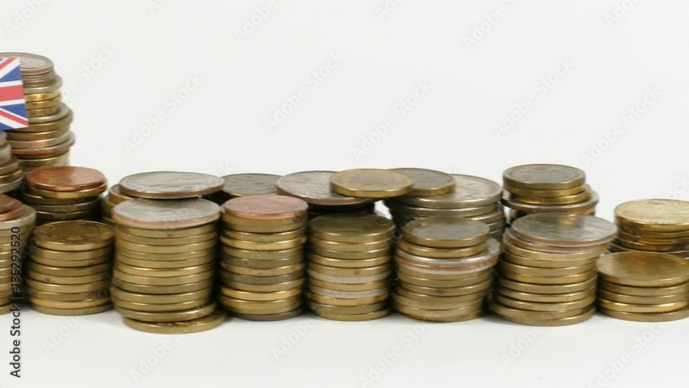 Great Britain flag waving with stack of money coins Great Britain flag waving with stack of money coins