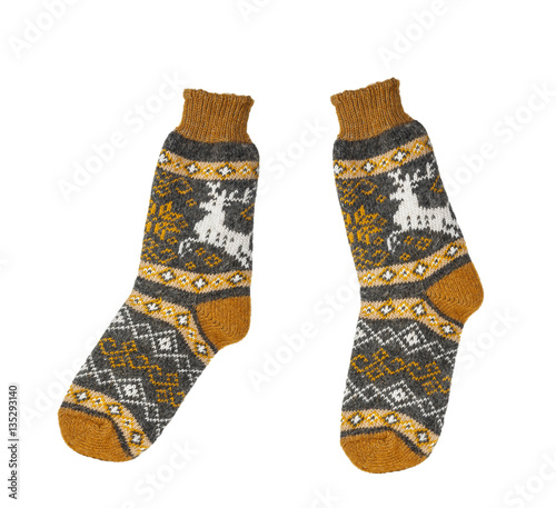Hand-knitted woolen socks on a white background isolated