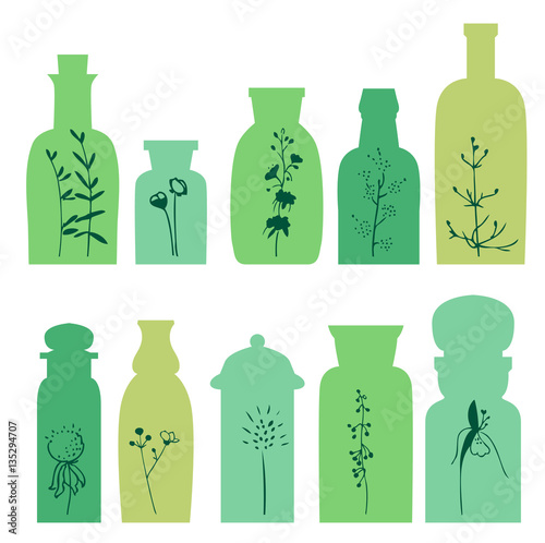 Set with small vintage bottles. Silhouette of plants.
