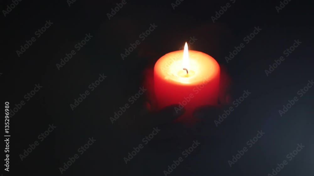 Burning candle in the dark. Backlight illumination. Burning candle in the dark. Backlight illumination.