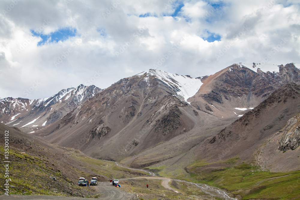 Beaultiful mountain landscape with cars and road