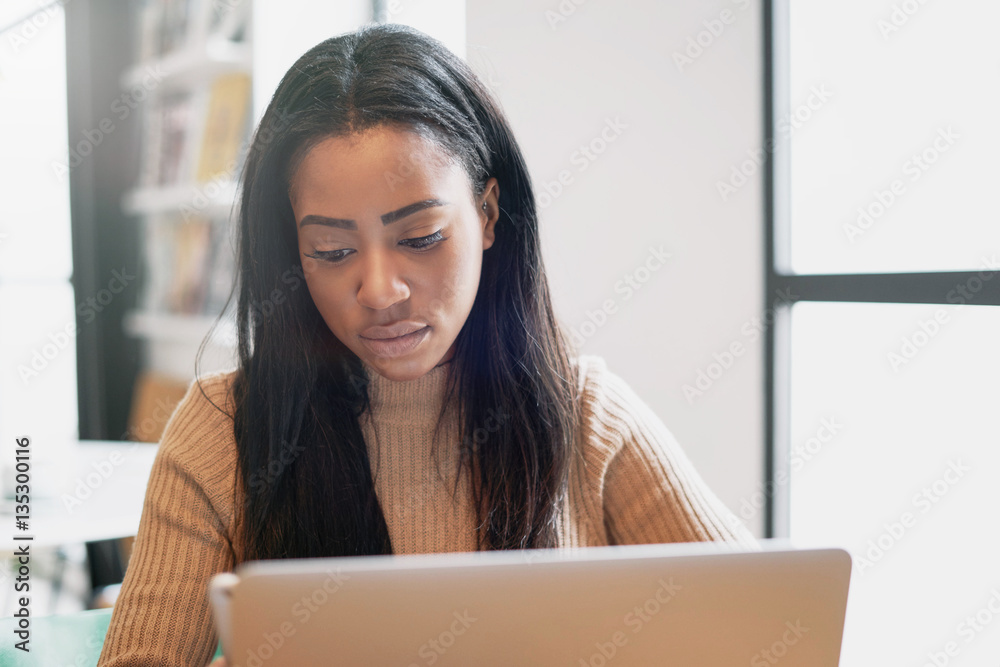 A beauty blogger is using modern smartphone and a portable computer for the work while sitting in a cafe. International student girl is studying online by a laptop connected to a wifi network. A beauty blogger is using modern smartphone and a portable computer for the work while sitting in a cafe. International student girl is studying online by a laptop connected to a wifi network.