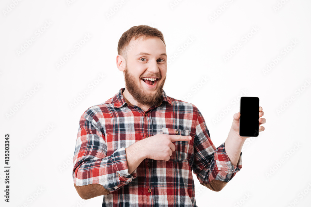 Bearded man in shirt showing blank smartphone screen Bearded man in shirt showing blank smartphone screen