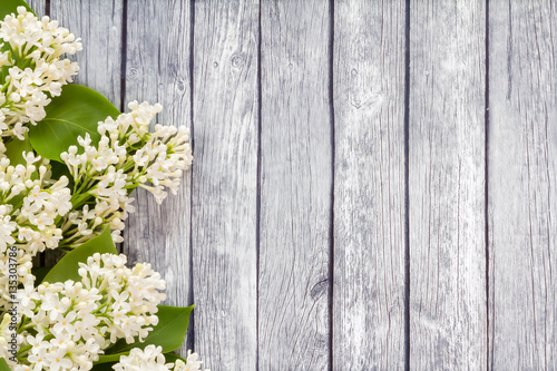 White flowers on a wooden background.