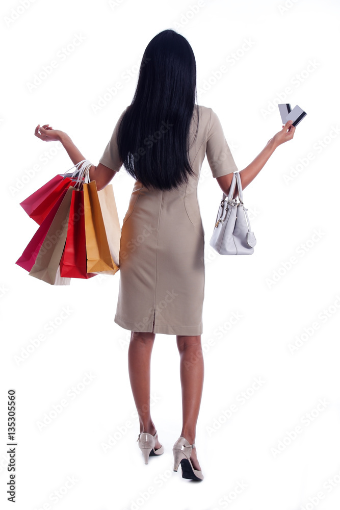 business women carrying colorful shopping bag and showing credit