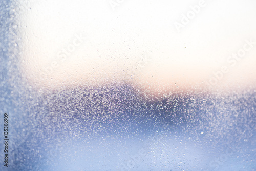 Raindrops on a window glass for rain.