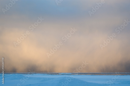Fotografie Squall snow clouds at dawn over Lake Huron landscape