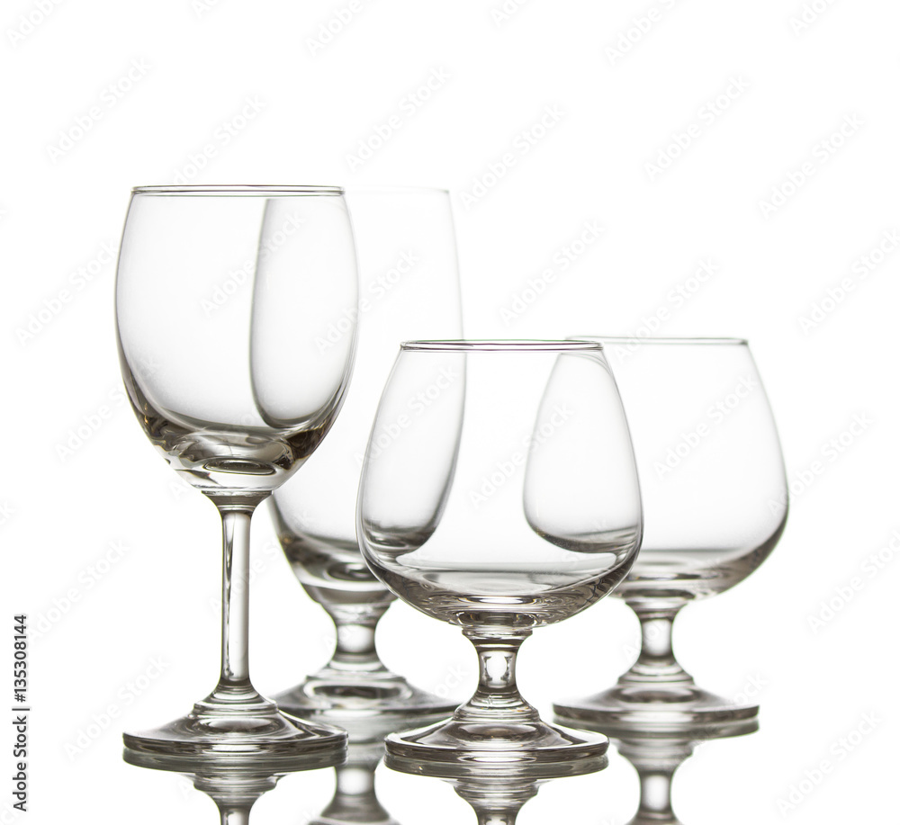 Clear crystal glasses,closeup shot on white isolated. Clear crystal glasses,closeup shot on white isolated.