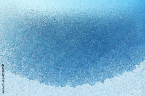 Frozen glass window on the balcony, absolutely nothing can be seen through the frozen window, can be used as a background image in cool colors