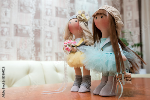 Two handmade rag dolls - blonde and brown-haired