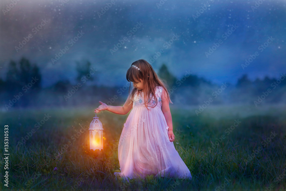 Fairytale portrait of Little girl with lightning at the night field Fairytale portrait of Little girl with lightning at the night field