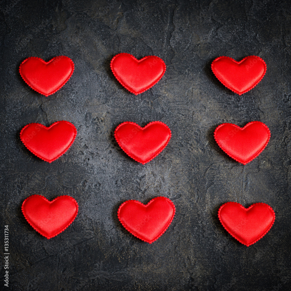Satin red hearts on a dark background. Valentine's Day card. Satin red hearts on a dark background. Valentine's Day card.