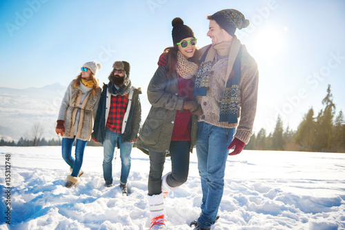 Two couples going for a winter walk