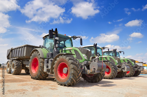 Agricultural machinery. Tractor, standing in a row