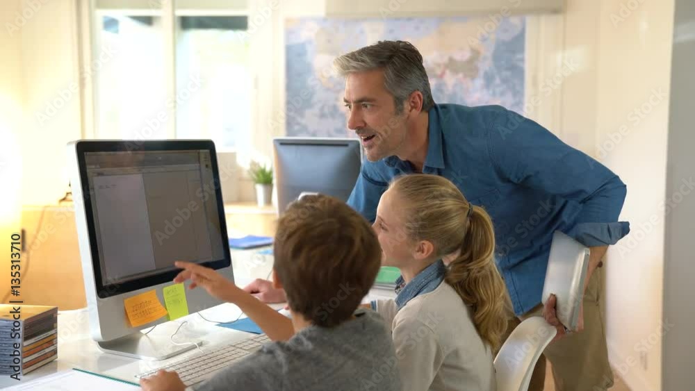 Teacher with school kids in computer laboratory Teacher with school kids in computer laboratory