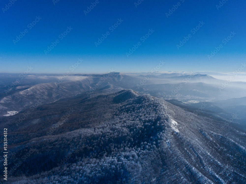 Aerial landscape of winter mountain valley.