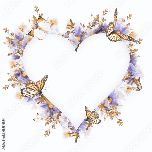 Fototapeta Naklejka Na Ścianę i Meble -  Amazing background with violets and primroses. Yellow and red flowers on a white blank. Floral card nature. Flowers and butterflies bokeh.