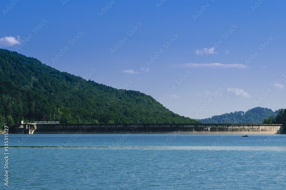 Paltinul Lake dam with forest background. Romania, Prahova, Europe