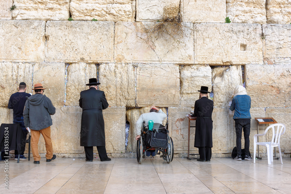 The Western wall is the holiest place to Judaism in the old city of Jerusalem, Israel. The Western wall is the holiest place to Judaism in the old city of Jerusalem, Israel.