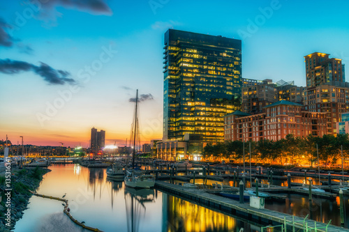 Baltimore, USA. Harbor and street view at sunset and deep colored sky. Splittoned, vivid image  photo