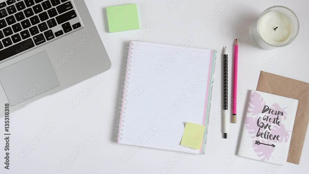 Desktop with laptop and blank page notebook in the center. Top view Desktop with laptop and blank page notebook in the center. Top view