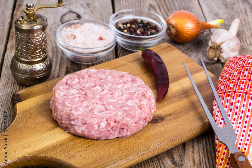 Minced meat for cooking hamburger on wooden board Minced meat for cooking hamburger on wooden board