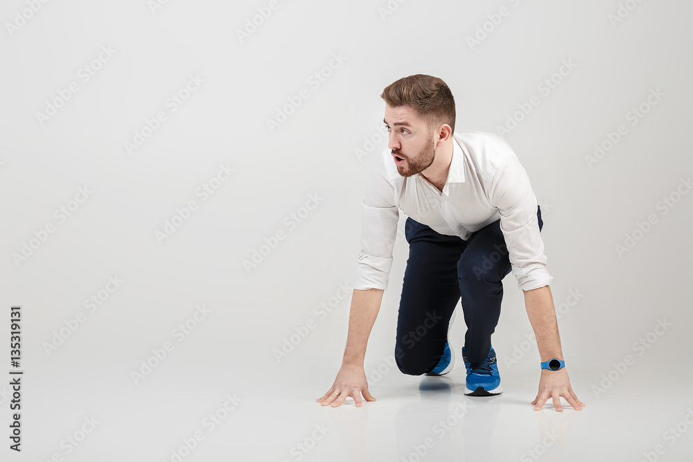 businessman with beard in white shirt on position of start ready businessman with beard in white shirt on position of start ready
