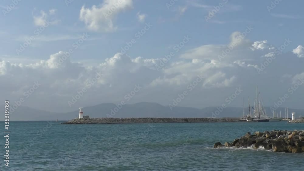 Beautiful view of the sea, the lighthouse and the ship Beautiful view of the sea, the lighthouse and the ship