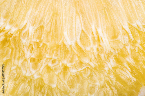 Close up of lemon or pamela texture pulp of the fruit.