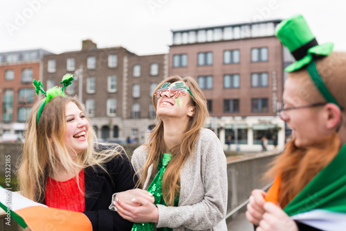 Group of Friends Having Fun During St Patrick 's Day in Dublin I photo