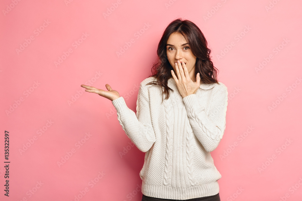 Surprised Beauty funny teenage girl showing empty copy space Surprised Beauty funny teenage girl showing empty copy space