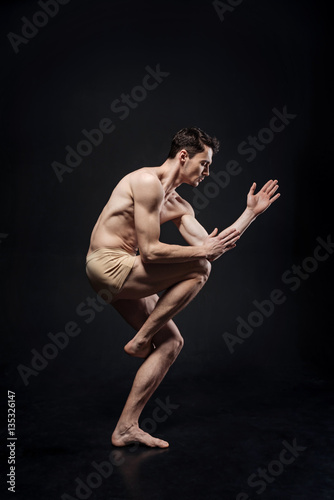 Creative young gymnast performing in the studio