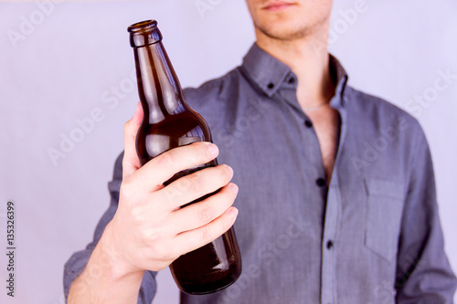 Man holding a bottle of beer