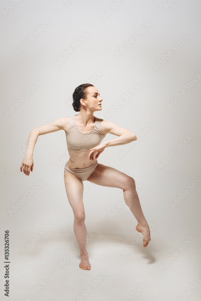 Charismatic dancer performing in the white room