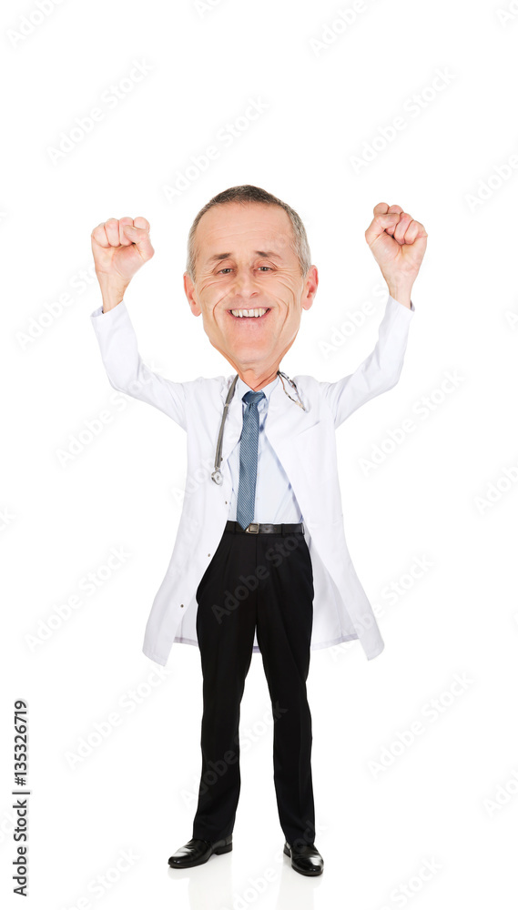 Happy cheerful male doctor with raised arms