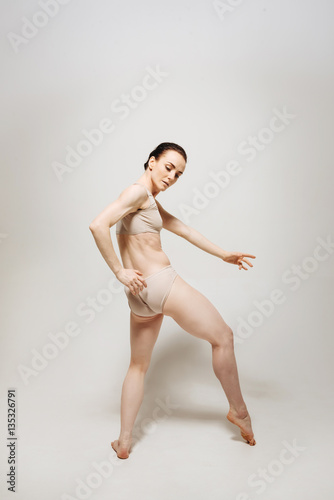 Inventive young ballet dancer performing in the studio