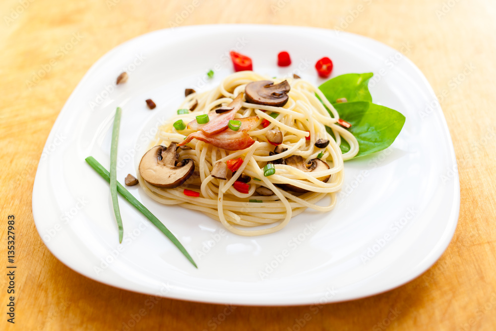 Pasta with mushrooms and vegetables on a plate Pasta with mushrooms and vegetables on a plate