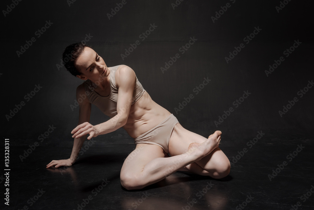 Concentrated young dancer performing in the studio