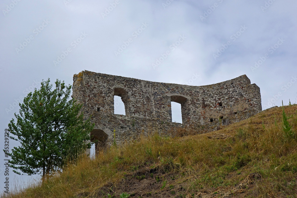 wall standing as a remnant of the medieval castle ruins